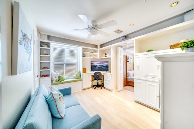 living room featuring light hardwood / wood-style flooring and ceiling fan