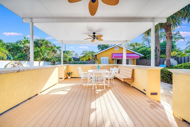 wooden deck featuring ceiling fan