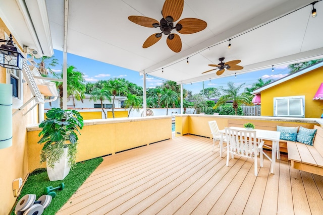 wooden terrace featuring ceiling fan