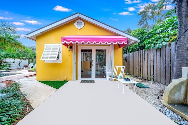 exterior space with french doors and a patio area