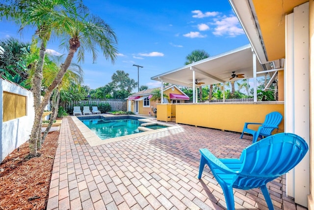 view of swimming pool featuring a patio and ceiling fan