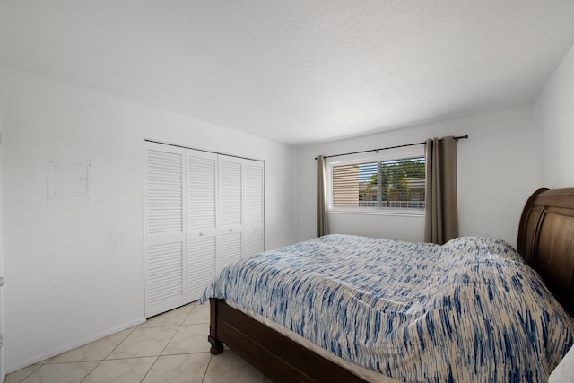 tiled bedroom featuring a closet