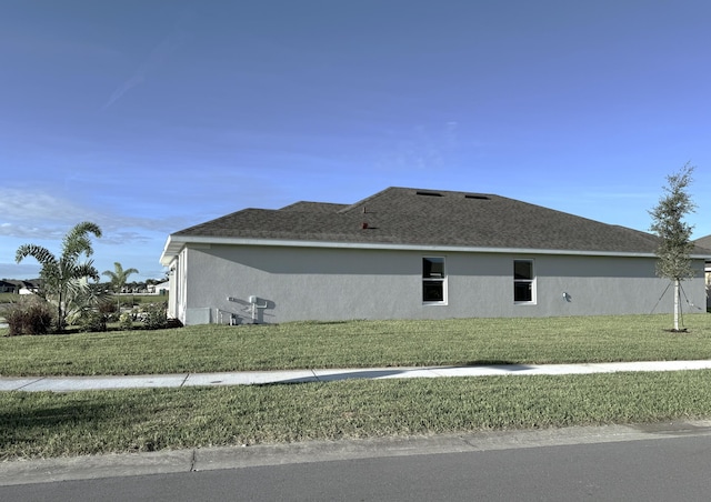 view of property exterior with a yard