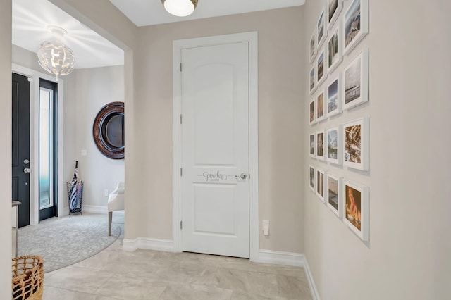 foyer with a chandelier