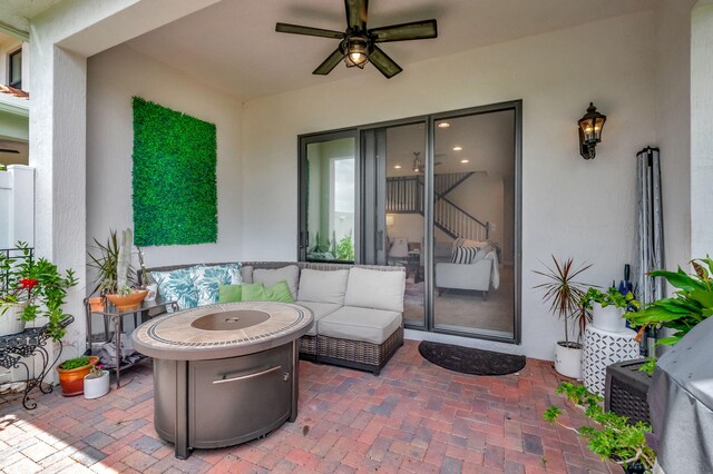 view of patio with outdoor lounge area and ceiling fan