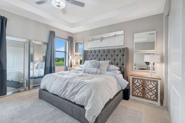 carpeted bedroom with a closet and ceiling fan