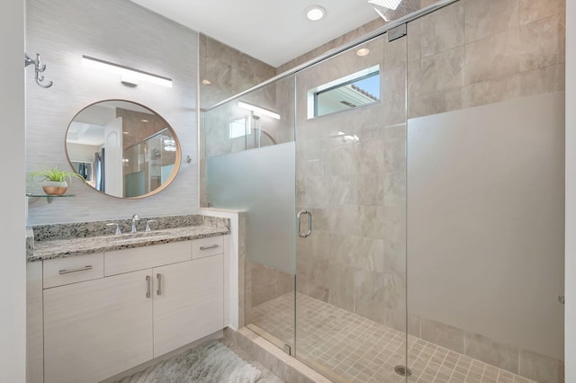 bathroom with vanity and walk in shower