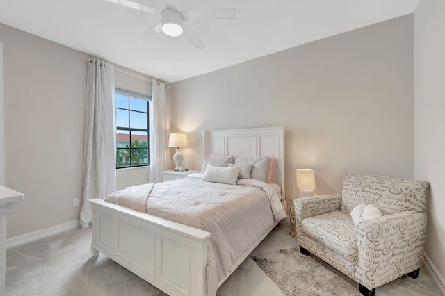 bedroom with light colored carpet and ceiling fan