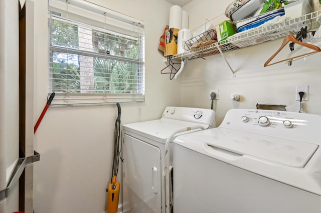 washroom featuring washer and clothes dryer