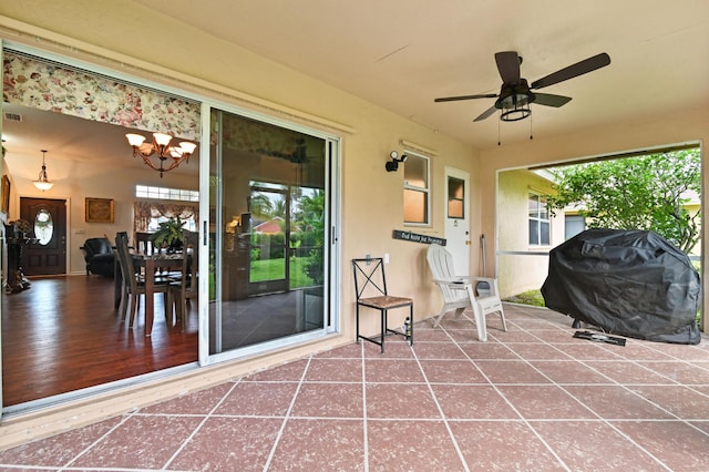 view of patio featuring ceiling fan and grilling area