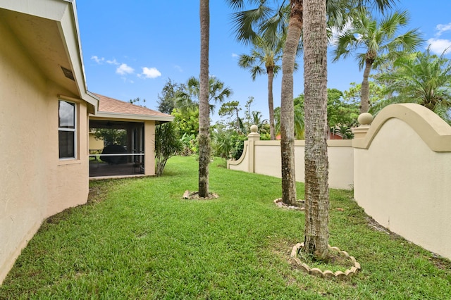 view of yard with a sunroom