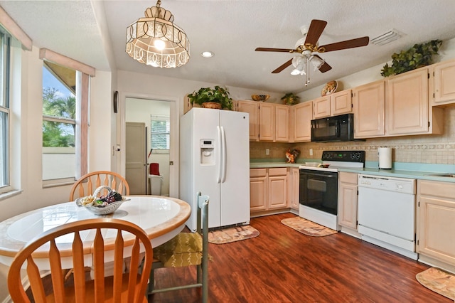 kitchen featuring ceiling fan, decorative backsplash, white appliances, dark wood-type flooring, and pendant lighting