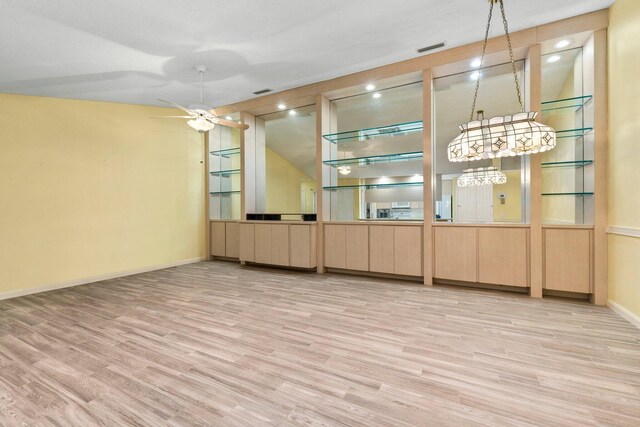 unfurnished room with ceiling fan and light wood-type flooring