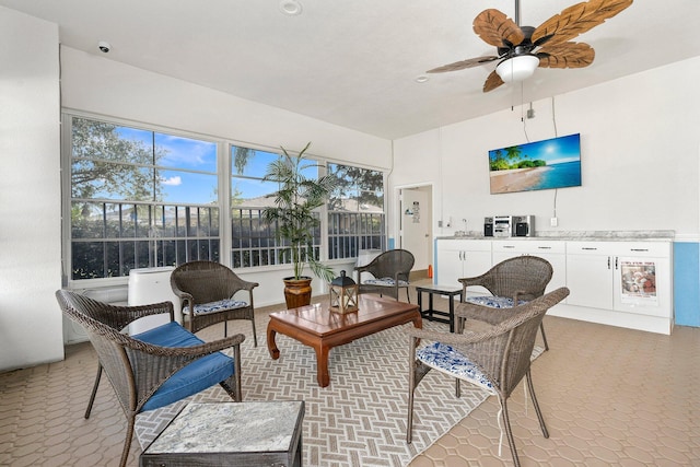 sunroom featuring ceiling fan