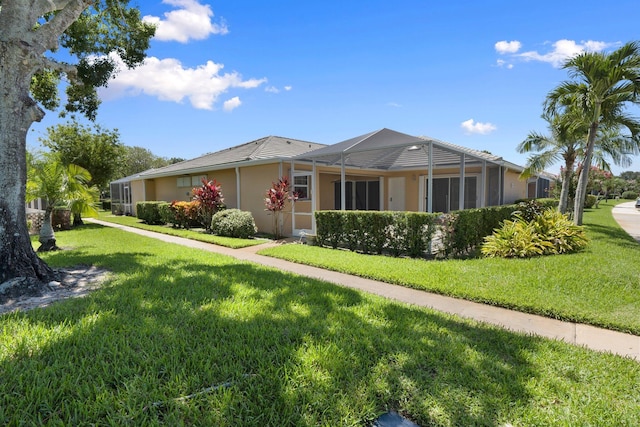 1217 NW Sun Terrace Cir Unit B, Port Saint Lucie, FL 34986 - view of front of house featuring a front lawn and stucco siding