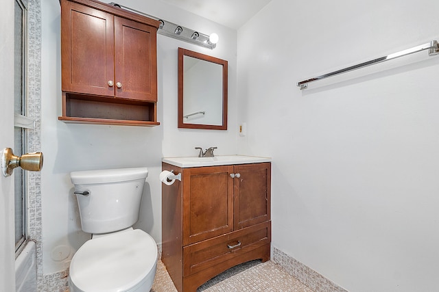 full bathroom featuring vanity, shower / bath combination with glass door, toilet, and tile patterned floors