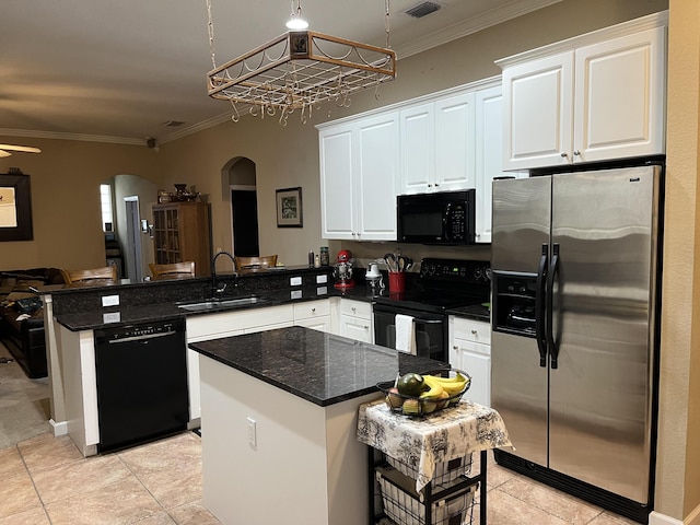 kitchen featuring kitchen peninsula, white cabinetry, sink, and black appliances