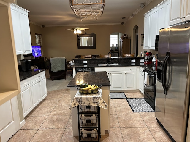 kitchen with white cabinetry, a kitchen island, kitchen peninsula, and stainless steel refrigerator with ice dispenser