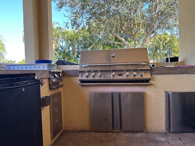 view of patio with area for grilling and grilling area