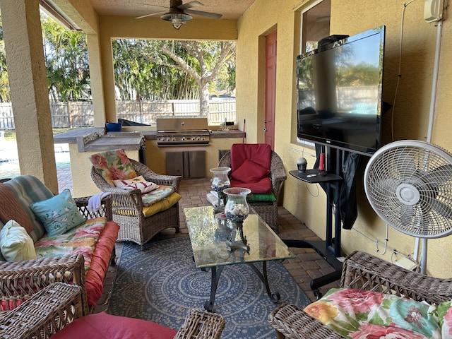 view of patio featuring an outdoor living space, grilling area, and ceiling fan