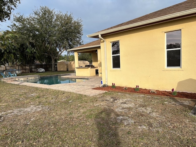 view of pool with area for grilling, a patio area, and a storage shed