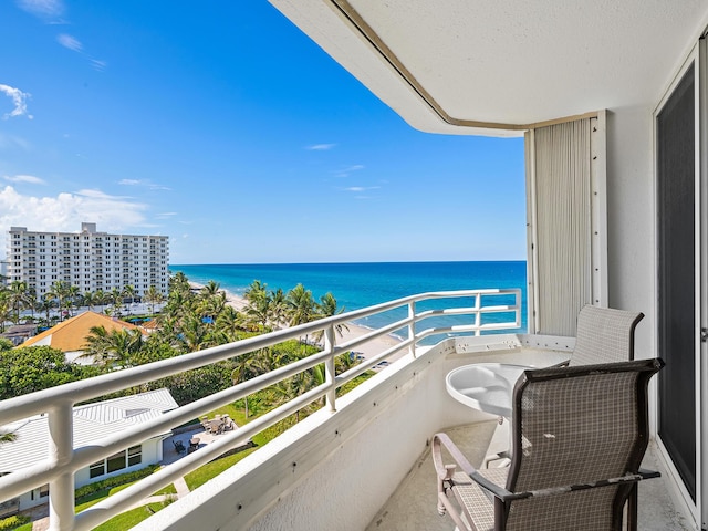 balcony featuring a water view