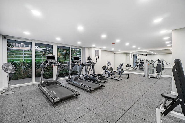 workout area featuring floor to ceiling windows