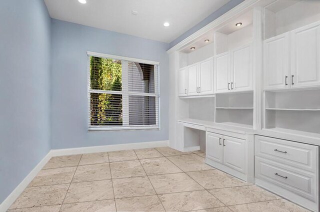 interior space featuring light tile patterned floors