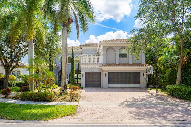 mediterranean / spanish house with a garage