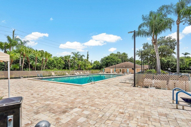 view of swimming pool with a patio area