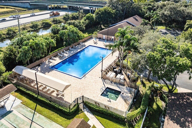 view of pool with a water view