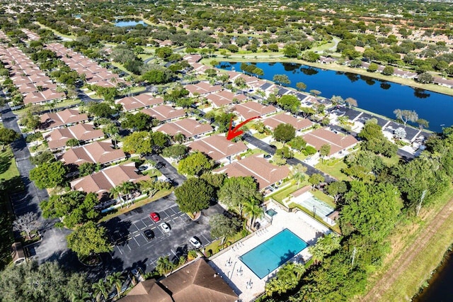 birds eye view of property with a water view