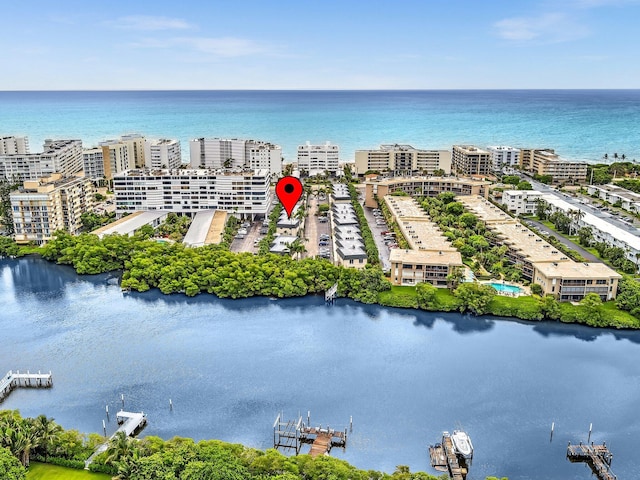 birds eye view of property with a water view