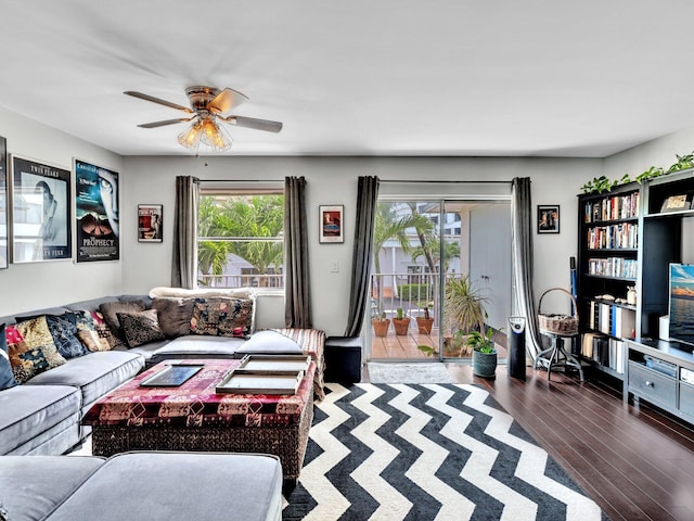 living room with ceiling fan and dark hardwood / wood-style floors