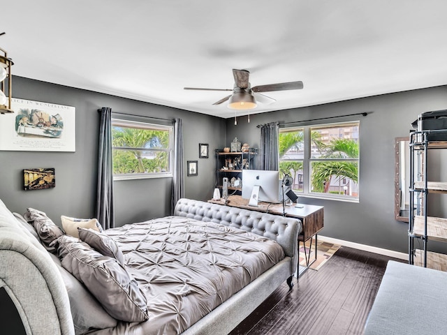 bedroom featuring ceiling fan and dark wood-type flooring