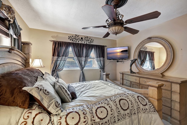 bedroom featuring a textured ceiling and ceiling fan