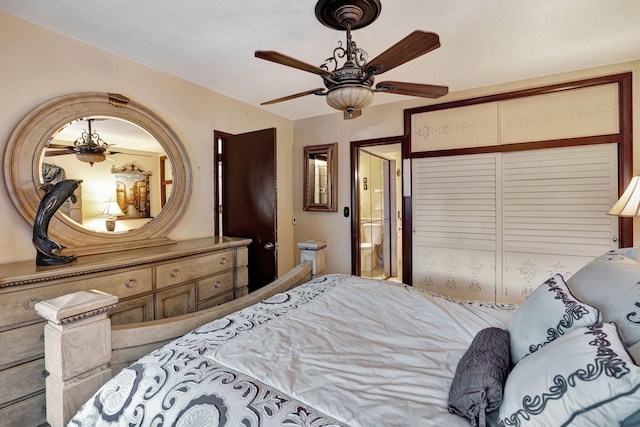 bedroom with ensuite bath and ceiling fan