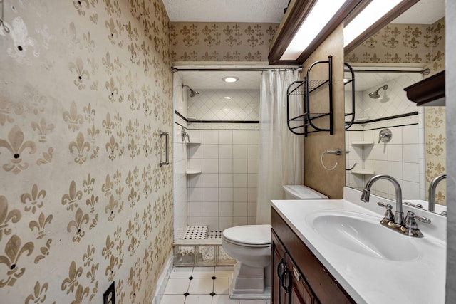 bathroom featuring tile patterned flooring, a textured ceiling, toilet, vanity, and curtained shower