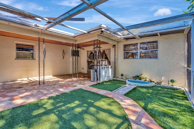 exterior space with a patio area, a lanai, and a yard