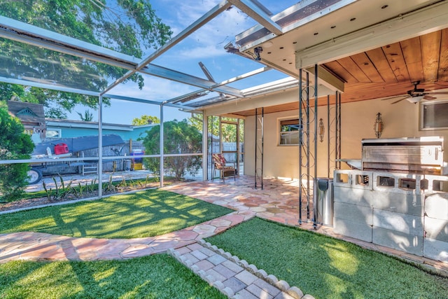 unfurnished sunroom with ceiling fan