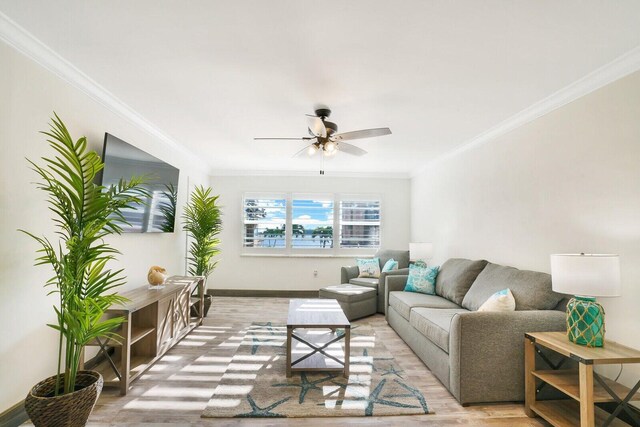 living room with crown molding and ceiling fan