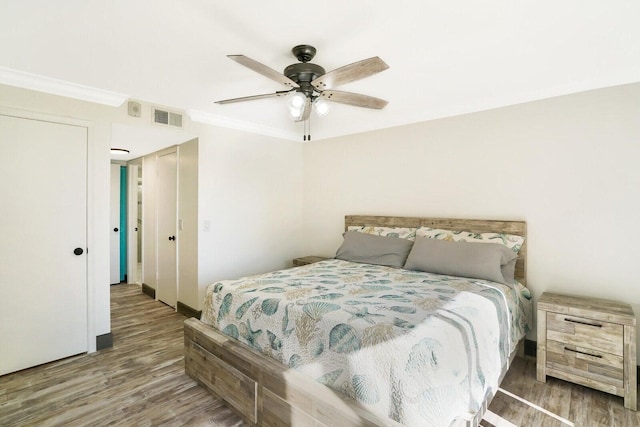 bedroom with ceiling fan and hardwood / wood-style floors