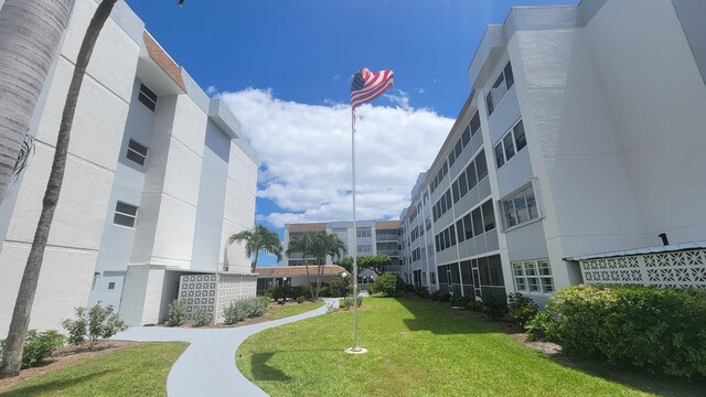 view of home's community with a yard