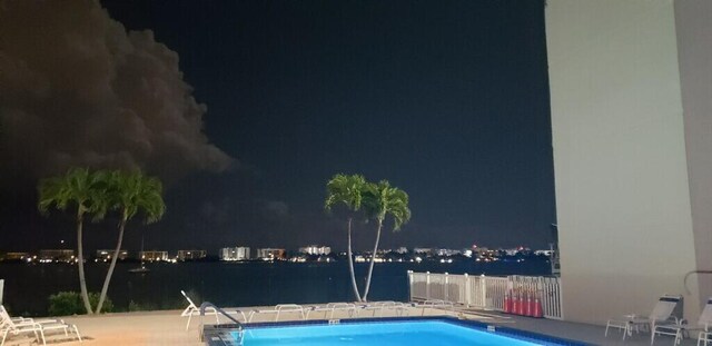 pool at twilight with a water view