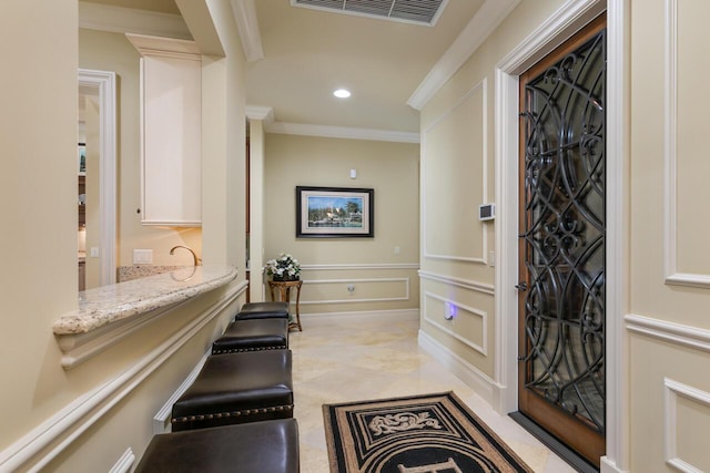 7380 SE Medalist Pl, Hobe Sound, FL 33455 - entryway with crown molding, recessed lighting, and visible vents
