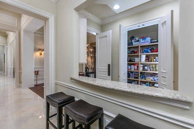 bar featuring crown molding and recessed lighting