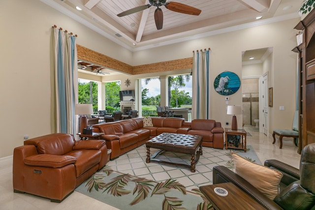 living room with a ceiling fan, recessed lighting, wood ceiling, and a high ceiling