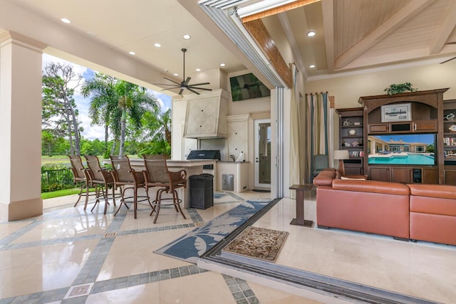 view of patio / terrace featuring outdoor wet bar and ceiling fan