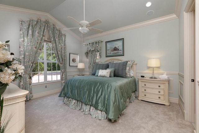 bedroom with lofted ceiling, ceiling fan, crown molding, and light colored carpet