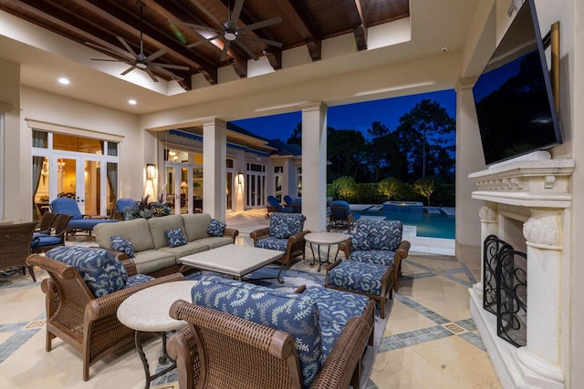 view of patio with a pool with connected hot tub, an outdoor living space, and a ceiling fan